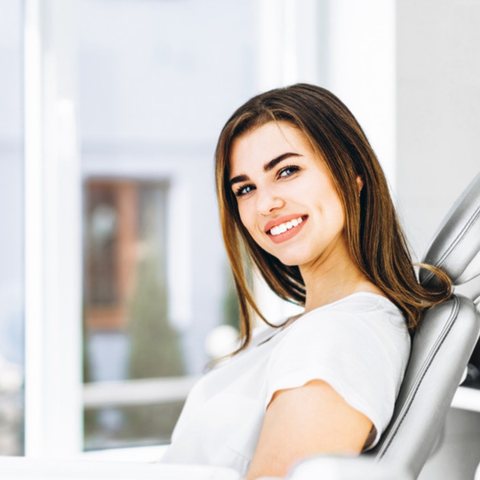 Smiling woman in a dental chair